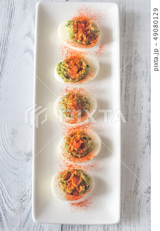 Guacamole and bacon deviled eggs 49080129