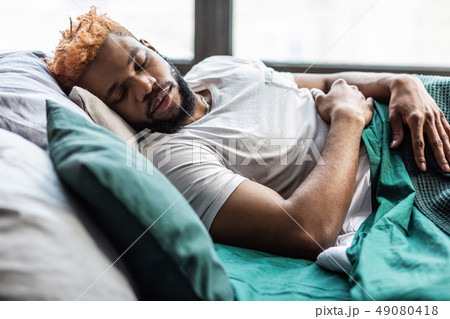 Handsome nice young man resting at home 49080418