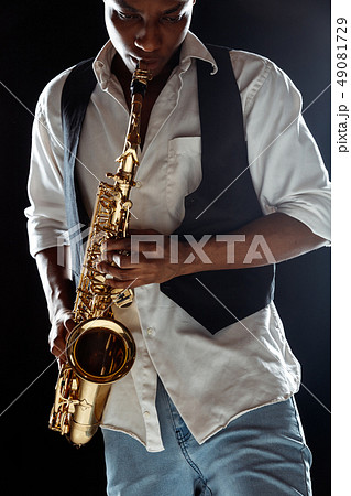 African American jazz musician playing the saxophone. African American jazz musician playing the saxophone. 49081729