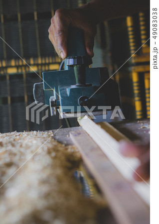 close up wood drill machine working in home work close up wood drill machine working in home work 49083038