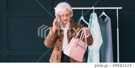 elegant senior lady wardrobe consultant copy space 49083524