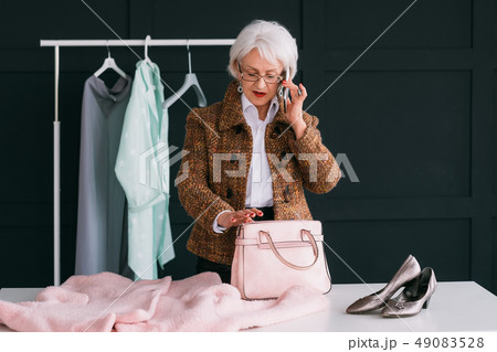 senior elegant lady glamor lifestyle pink outfit 49083528