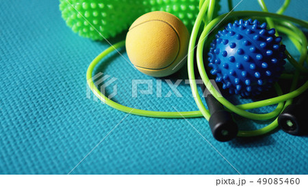 Massage ball roller for self massage, reflexology and myofascial release on blue Massage ball roller for self massage, reflexology and myofascial release on blue 49085460