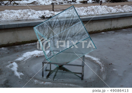 Decorative glass cube on ice 49086413