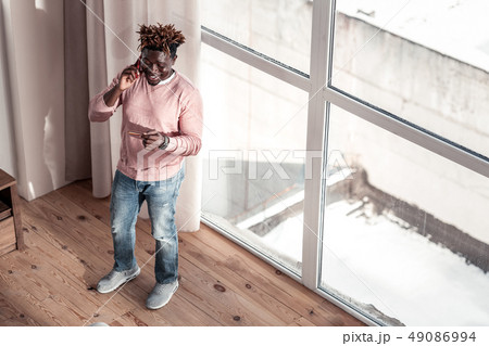 Joyful stylish freelancer having pause after work Joyful stylish freelancer having pause after work 49086994
