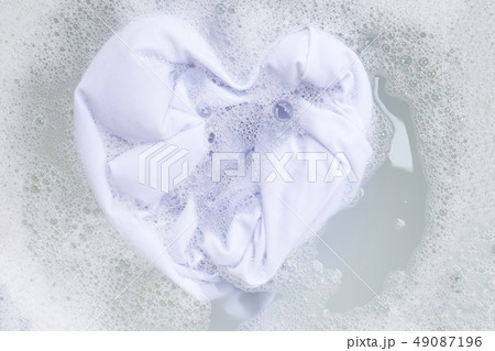 Soak a cloth before washing, white cloth 49087196