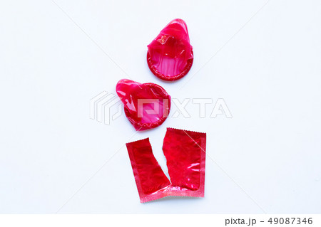 Red condom on white 49087346