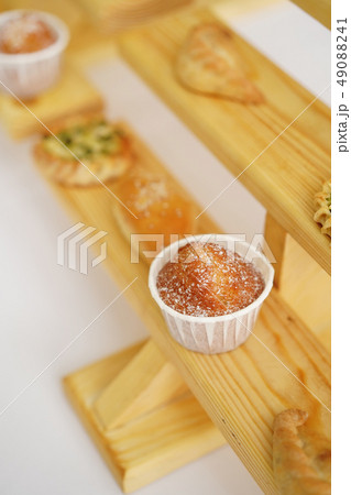Baked pies and cakes on wooden shelves 49088241