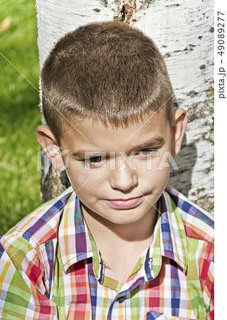 Cute brunette boy eleven years old 49089277