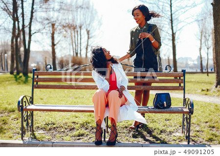 fashionable black girls in a park 49091205