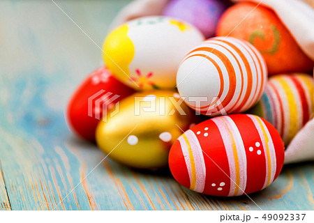 Several colorful Easter eggs in sack close 49092337