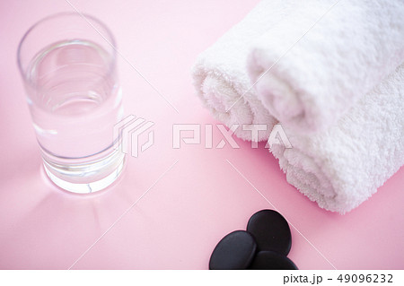 Spa. White Cotton Towels Use In Spa Bathroom on Pink Background. Towel Concept. Photo For Hotels and 49096232