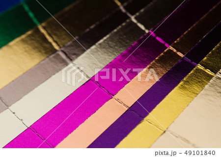 multicolor hotfoil paper sampler isolated on white multicolor hotfoil paper sampler isolated on white 49101840