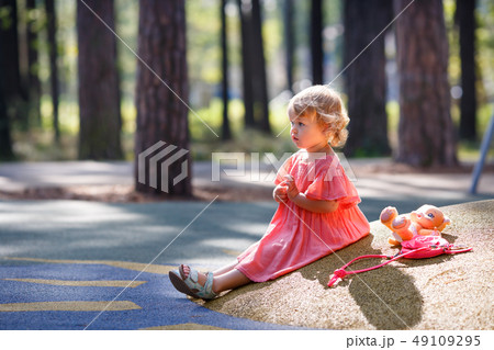 Sweet blond little baby girl in beautiful apricot Sweet blond little baby girl in beautiful apricot 49109295