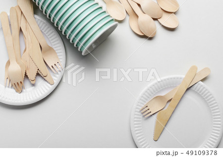 Wooden single use kitchenware and paper cups and 49109378