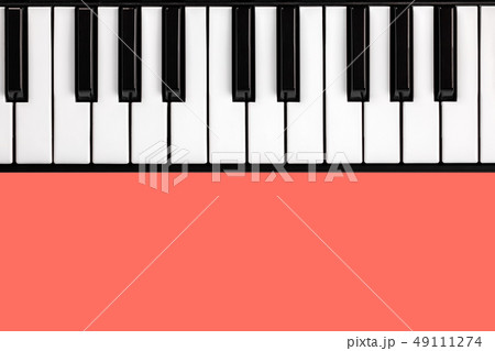 piano keyboard on isolated living coral background 49111274