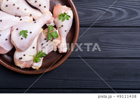 Raw chicken legs with spices and parsley. Food Raw chicken legs with spices and parsley. Food 49111438