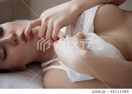 Attractive sensual woman in lingerie on bed in 49111489