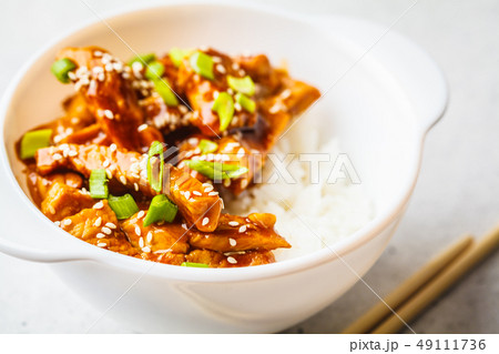 Asian teriyaki chicken with rice, sesame Asian teriyaki chicken with rice, sesame 49111736