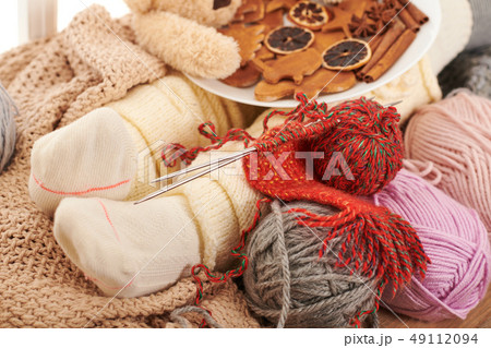 Child legs in warm socks are on a window sill with Child legs in warm socks are on a window sill with 49112094