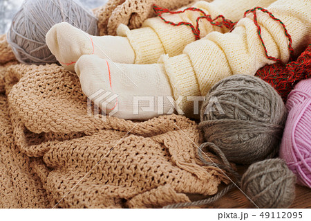 Child legs in warm socks are on a window sill with 49112095