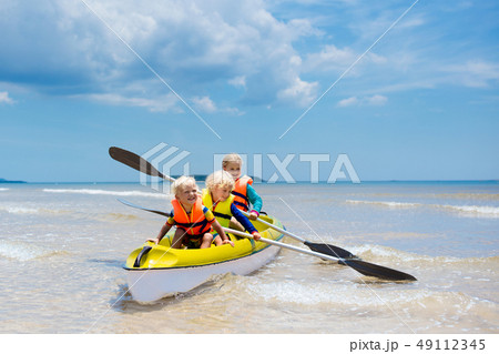 Kids kayaking in ocean. Children in kayak in 49112345