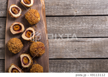 Traditional Austrian plum dumplings Traditional Austrian plum dumplings 49113112