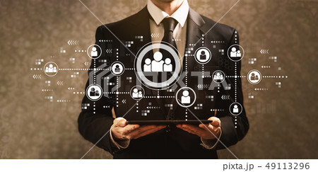 Social connections with businessman holding a tablet computer  49113296