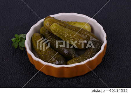 Pickled cucumbers heap in the bowl Pickled cucumbers heap in the bowl 49114552