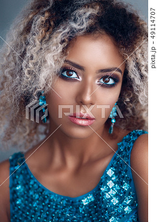Close-up portrait of mixed woman with bright make-up 49114707