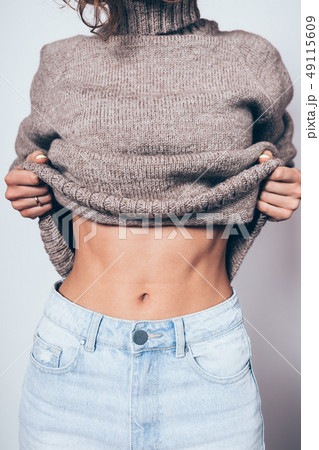 Close-up of flat female stomach Close-up of flat female stomach 49115609