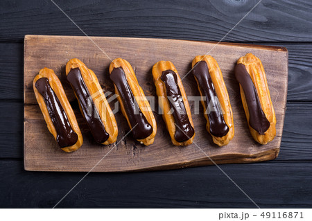French dessert eclair with chocolate . 49116871