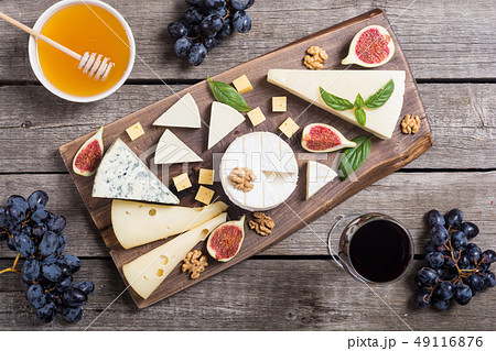Cheeseboard with cheese brie , parmesan , 49116876
