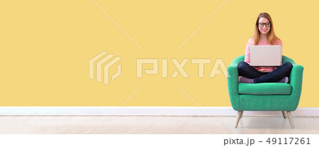 Young woman using a laptop 49117261