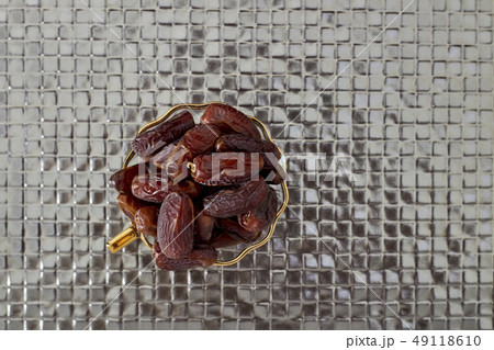 Palm Dates on silver floor Palm Dates on silver floor 49118610