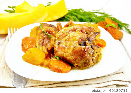 Chicken roast with pumpkin and dried apricots Chicken roast with pumpkin and dried apricots 49120751