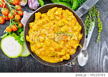 Goulash with tomato and zucchini in pan 49120763