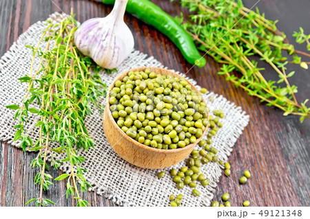 Mung beans in wooden bowl with thyme and pepper on 49121348