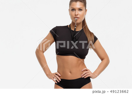 Attractive sensual woman in lingerie with whistle 49123662
