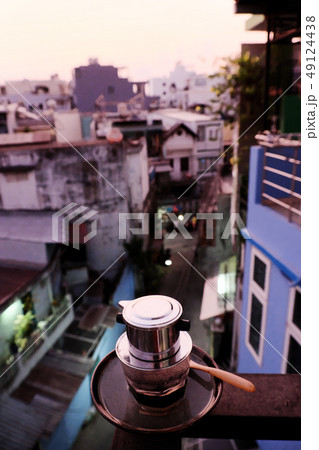 Coffee time at early morning in balcony of house Coffee time at early morning in balcony of house 49124438