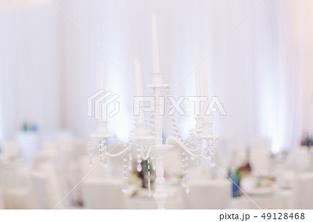 Decoration of tables in restaurant for wedding. Beautiful white decor inside 49128468