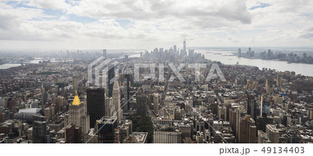 Panorama of Manhattan, skyscrapers in the distance drown in the haze of clouds Panorama of Manhattan, skyscrapers in the distance drown in the haze of clouds 49134403