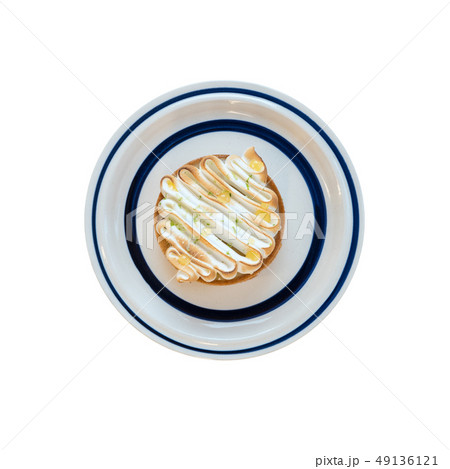 Homemade lemon tart decorated with meringue swirls Homemade lemon tart decorated with meringue swirls 49136121