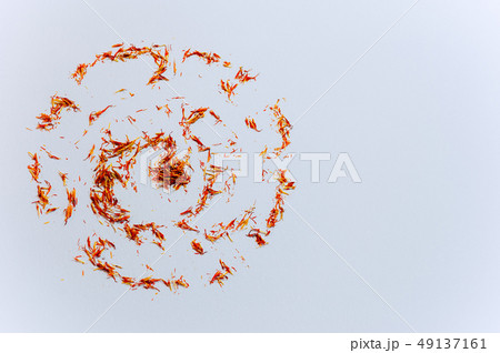 circle red saffron threads on white backdrop 49137161