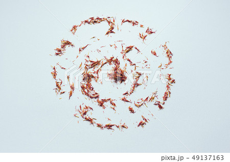 circle red saffron threads on white backdrop 49137163