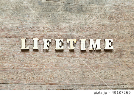 Letter block in word life time on wood background Letter block in word life time on wood background 49137269