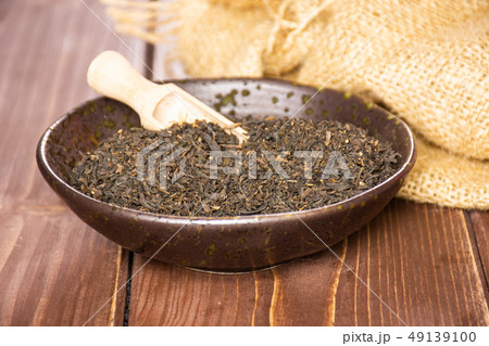 Black tea earl grey on brown wood Black tea earl grey on brown wood 49139100