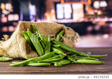 Green sugar snap pea with restaurant Green sugar snap pea with restaurant 49139285