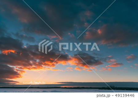 Natural Sunset Sunrise Over Field Or Meadow. Colorful Sky Over Winter Snowy Ground. Landscape Under 49139446