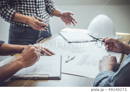 Architecture Engineer Teamwork Meeting, Drawing and working for 49140273